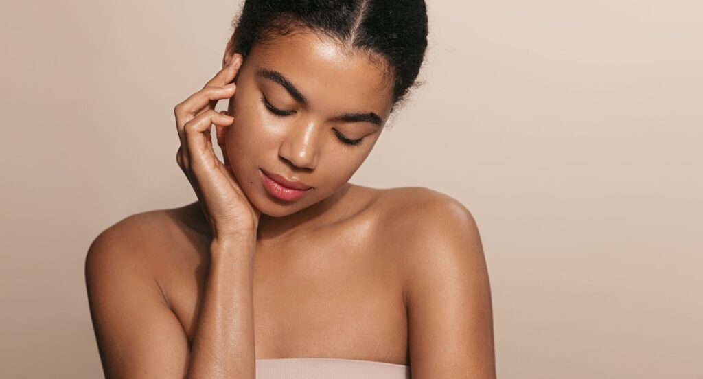 Woman with an even, radiant complexion after Cosmelan pigment correction in the Bronx
