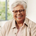 Smiling senior woman enjoying clear vision after cataract surgery with an intraocular lens